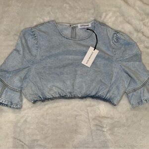 Revolve weworewhat cropped denim top.
Size large! New with tags!